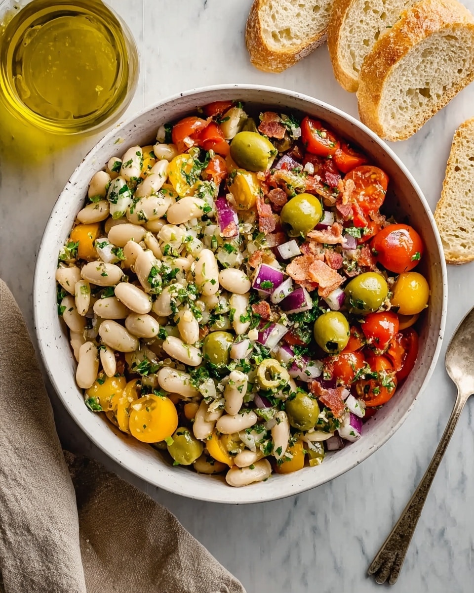 A white bowl filled with a colorful salad featuring three main layers: the base layer consists of plump white beans scattered evenly, the middle layer has chunks of yellow and red cherry tomatoes along with whole green olives mixed throughout, and the top layer is sprinkled with chopped green herbs and small pieces of red onion, giving a fresh texture. There are also some small pieces of white cheese and bits of bacon or similar meat spread on top, adding more texture. The bowl is placed on a white marbled surface, with a glass jar of olive oil on the top left, two slices of bread on the top right, and a beige cloth napkin on the bottom left. photo taken with an iphone --ar 4:5 --v 7